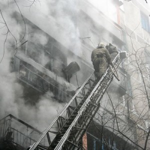 Help with Fire Safety Actions-Fireman on Ladder with Burning Building Help with Fire Safety Actions-Fireman on Ladder with Burning Building